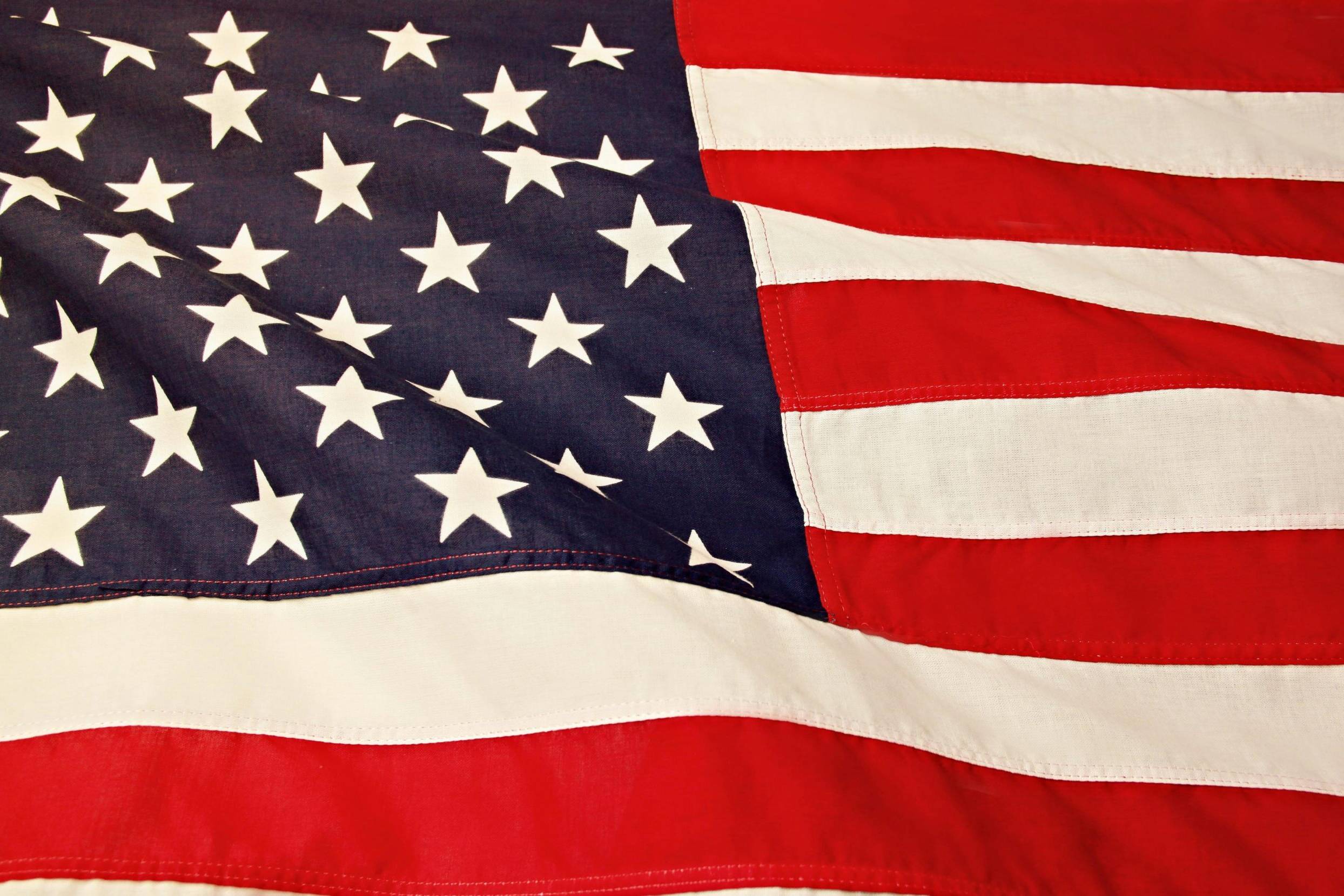 Detailed image of the American flag showcasing the stars and stripes symbolizing USA's patriotism and pride.