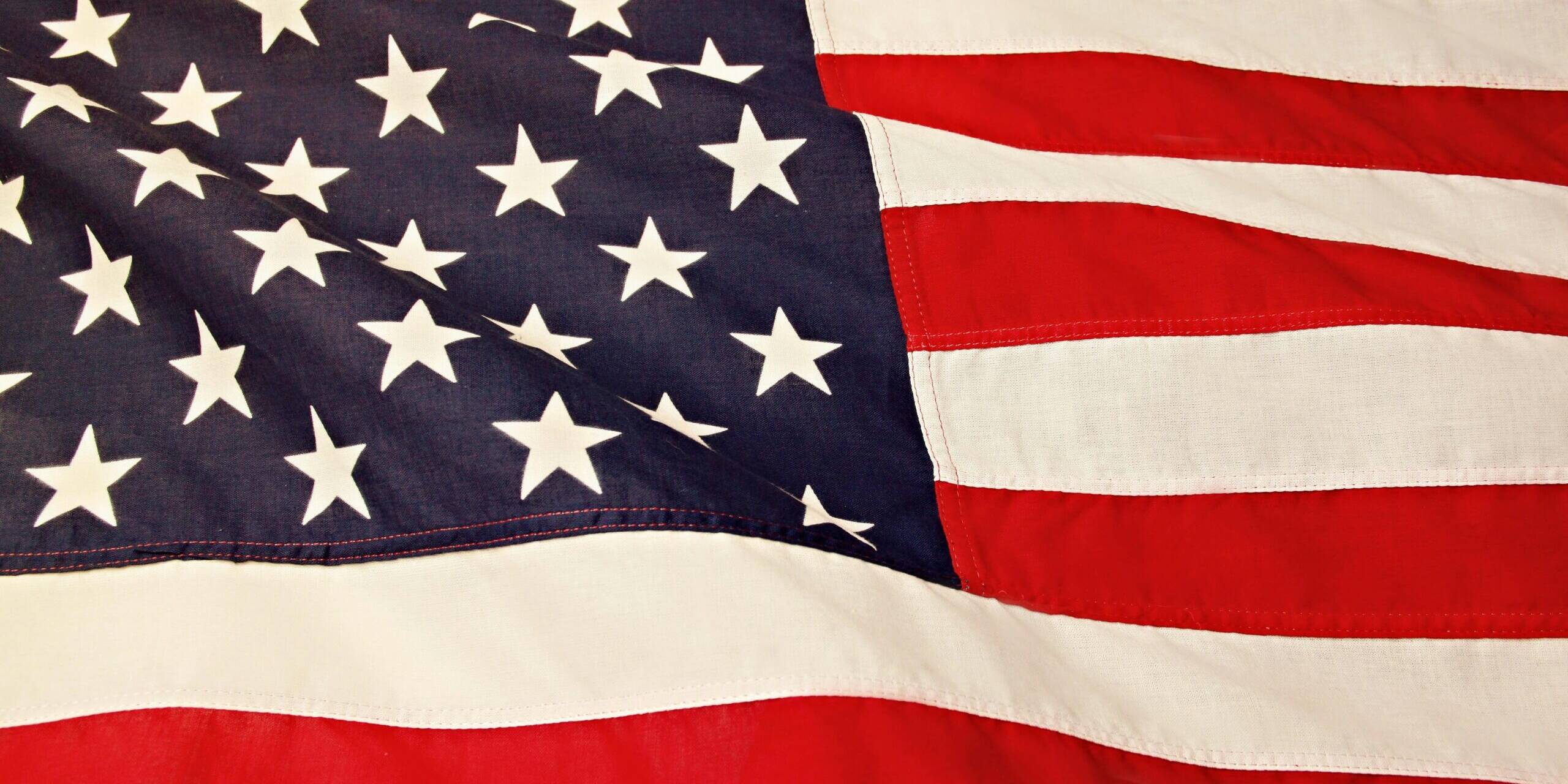 Detailed image of the American flag showcasing the stars and stripes symbolizing USA's patriotism and pride.